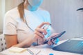 Woman disinfects the surface of the phone