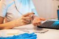 Woman disinfects the surface of the phone