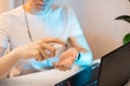 Woman disinfects the surface of the phone