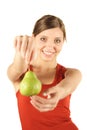 Woman displaying pear in hands
