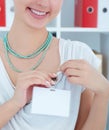 Woman displaying visitor badge. Preparation for the conference. Royalty Free Stock Photo