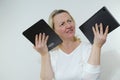 woman is dissatisfied she holds two tablets in hands tired displeased eyes online training no electricians manicure