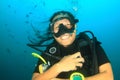 Woman diver swimming in deep blue water Royalty Free Stock Photo