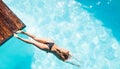 Woman diving in the pool