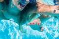 Woman diving underwater in resort swimming pool Royalty Free Stock Photo