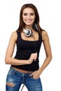 Woman DJ with earphones in jeans and black shirt.Smiling brunette. Beautiful fashion girl.Isolated background