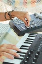 Hands woman DJ playing electronic music with a mixing table