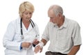 Woman doctor bandaging senior man's wrist Royalty Free Stock Photo