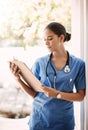 Woman doctor, clipboard and check notes for medical service, hospital documents and nursing registration or information Royalty Free Stock Photo