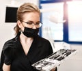 Woman doctor dentist surgeon with medical tools standing in dental Royalty Free Stock Photo