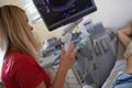 Woman doctor diagnostician specialist holding ultrasound probe
