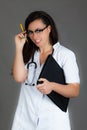 Woman doctor on grey background medical staff personell nurse Royalty Free Stock Photo