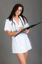 Woman doctor on grey background medical staff personell nurse Royalty Free Stock Photo