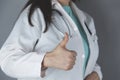 Woman doctor hand okay sign