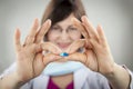 Woman doctor holding blue capsule