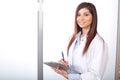 Woman doctor holding a chart in a modern office Royalty Free Stock Photo