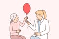 Woman doctor and little girl suffering from cancer with balloon are in oncology clinic