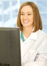 Woman Doctor Looking At Her Computer Royalty Free Stock Photo