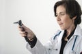 Woman doctor with a otoscope in her hand.