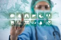 The woman doctor pressing buttons with various medical icons Royalty Free Stock Photo