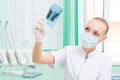 Woman doctor in protective mask looking at x-ray Royalty Free Stock Photo