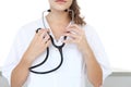 Woman Doctor puts stethoscope, isolated