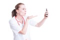 Woman doctor sending blowing kisses on video call Royalty Free Stock Photo