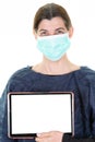 Woman doctor showing screen blank empty tablet computer face protect by mask isolated over white background