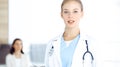 Woman - doctor standing in clinic. Physician at work, studio portrait. Medicine and health care concept Royalty Free Stock Photo