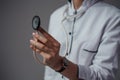 Woman doctor with stethescope dressed in white labcoat