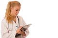 Woman doctor with stethoscope around neck writing illness symptoms of pacient on clipboard. Royalty Free Stock Photo