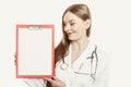 Woman doctor with stethoscope, clipboard and pen. Royalty Free Stock Photo