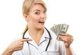 Woman doctor with stethoscope showing currencies dollar, corruption or bribe concept Royalty Free Stock Photo