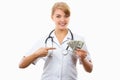 Woman doctor with stethoscope showing currencies dollar, corruption, bribe or paying for care concept Royalty Free Stock Photo