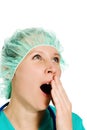 Woman doctor tired yawning
