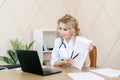 Woman doctor showing medical insurance to patient Royalty Free Stock Photo