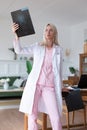 Woman doctor viewing X-rays in the office