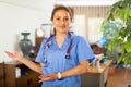 Woman doctor wear white medical uniform and stethoscope look at camera posing in clinic