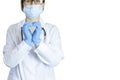 A woman doctor in a white coat, a blue mask and gloves on a white background. Royalty Free Stock Photo