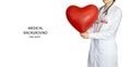 A woman doctor in a white coat with a large red heart in her hands. Royalty Free Stock Photo