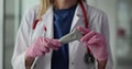 Woman doctor in work uniform holds ultrasound transducer device