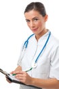 Woman doctor writing on clipboard Royalty Free Stock Photo