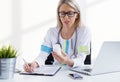 Woman doctor writing medicine prescription Royalty Free Stock Photo