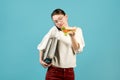 Woman with documents is talking on the phone and is about to eat a sandwich Royalty Free Stock Photo
