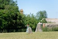 Woman does some yoga moves near to monolithic stones, avebury