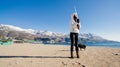 Woman with the dog on beach in winter Royalty Free Stock Photo