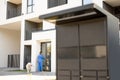 Woman with dog entering apartment building Royalty Free Stock Photo