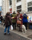 Woman with dog giving leaflets at Anti UKIP market stall in Thanet South