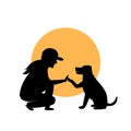 Woman and dog greeting silhouette Royalty Free Stock Photo