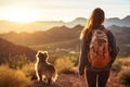 Woman and Dog Hiking in Mountains